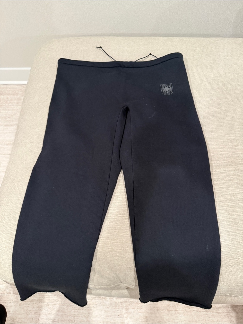 Black Cropped Sweatpants with Subtle Crest